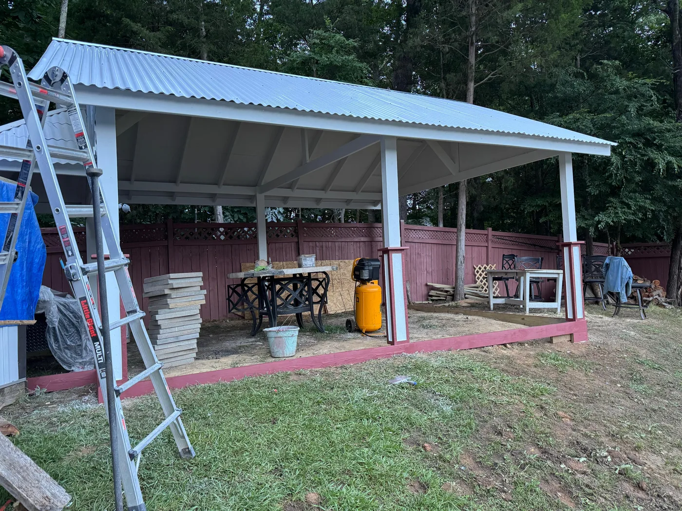 Backyard pavilion with metal roof under construction