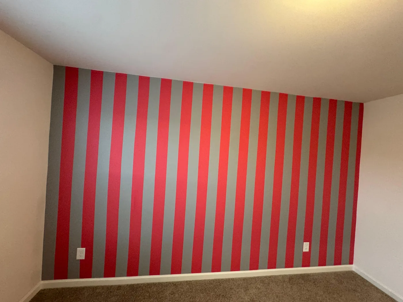 Red and gray striped accent wall with crisp lines